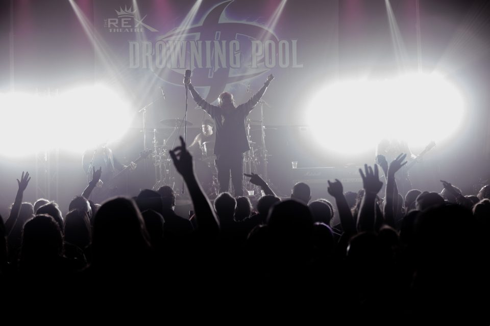 Drowning Pool at The Rex Theatre, crowd silhouetted against white light