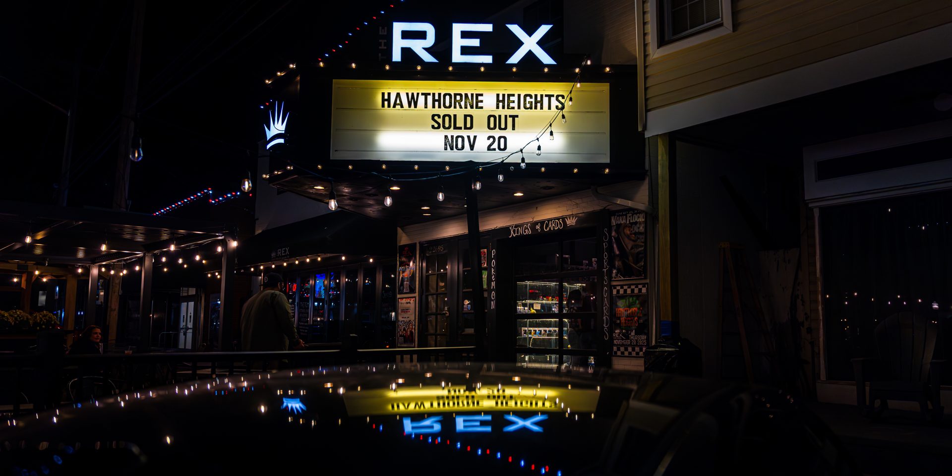 The Rex Theatre marquee lit up on Washington Street, Leonardtown