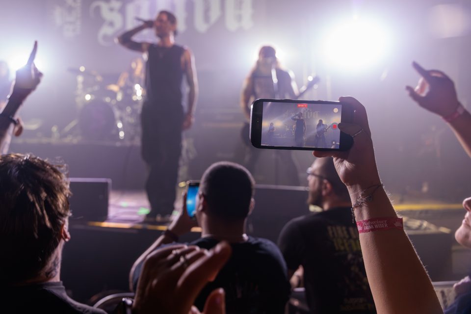 Crowd filming Saliva on their phones at The Rex Theatre