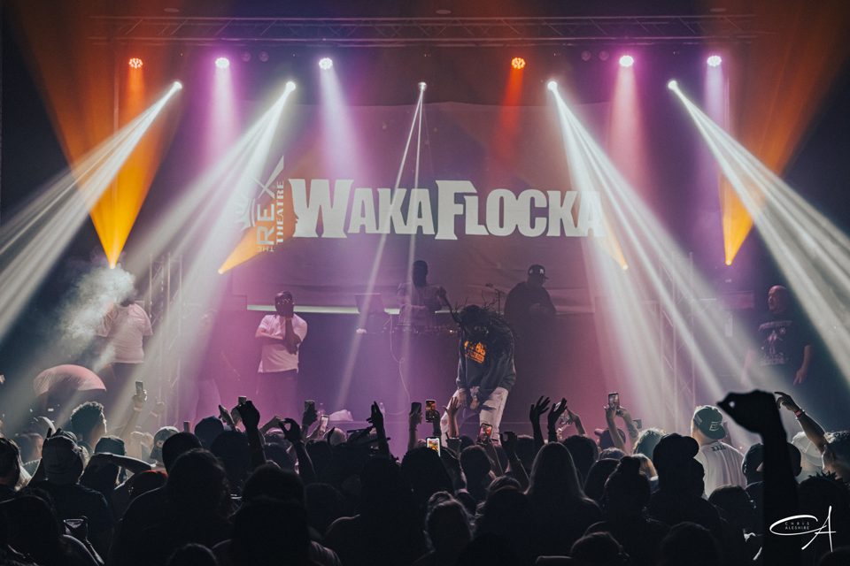Waka Flocka at The Rex Theatre, white beams over a packed floor